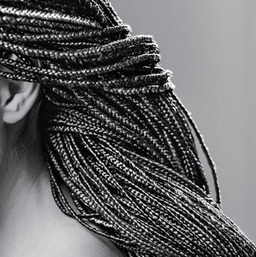 close up of afro pigtails braids in zizi and kanekalon technique with multi colored threads and dreadlocks