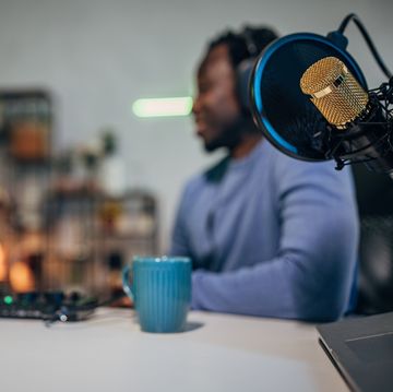 people in the podcast studio talking and recording